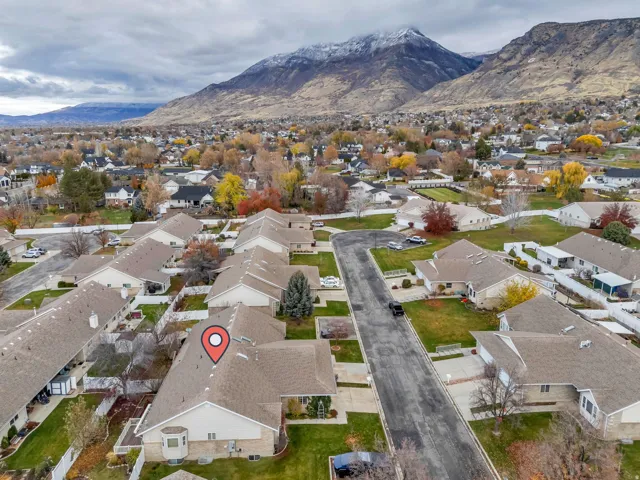 Aerial perspective of suburban area with a mountainous background
