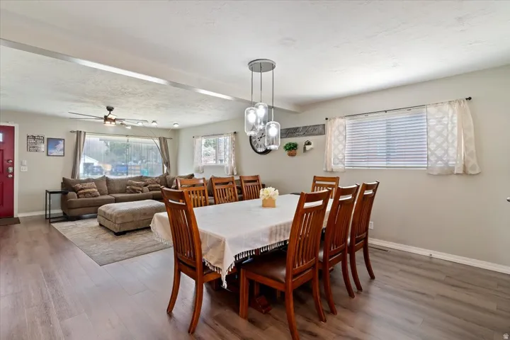 Dining space featuring LVP floors, and a ceiling fan