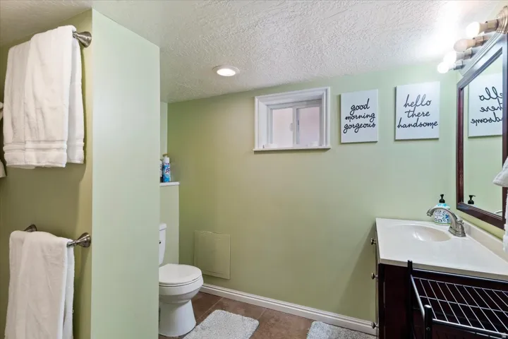 Bathroom featuring vanity, and bath shower combination