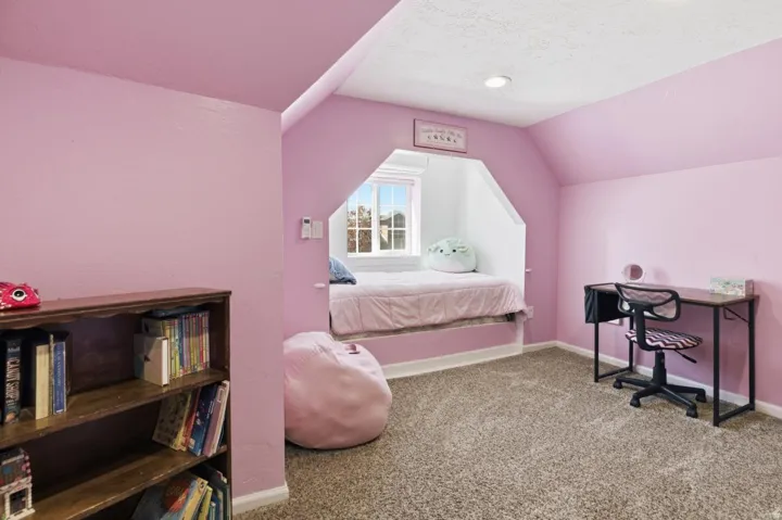 Bedroom with carpet flooring and baseboards