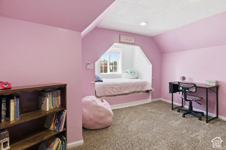 Bedroom with carpet flooring and baseboards