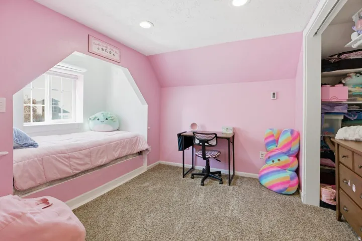 Carpeted bedroom featuring baseboards