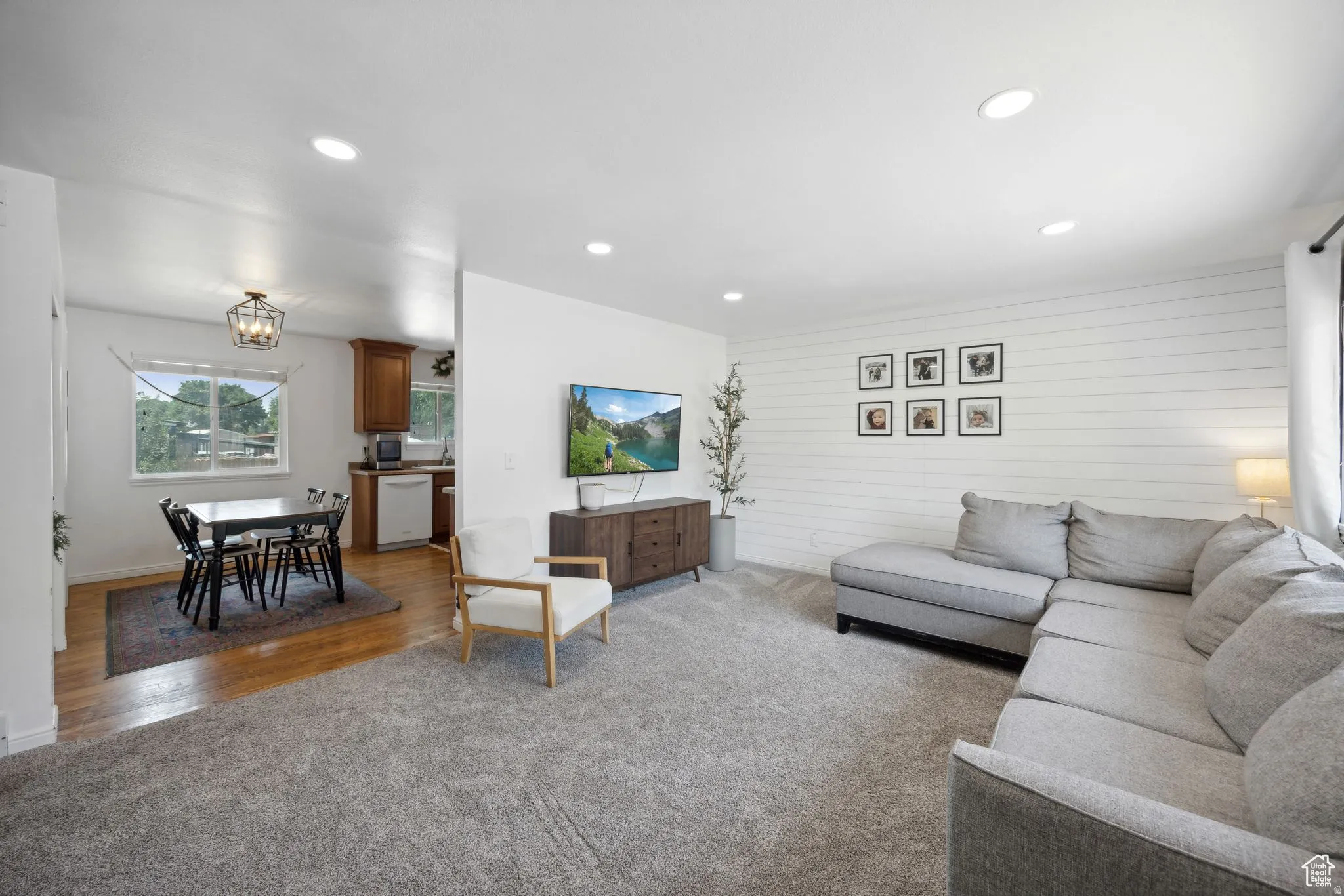 Living area with carpet flooring and recessed lighting