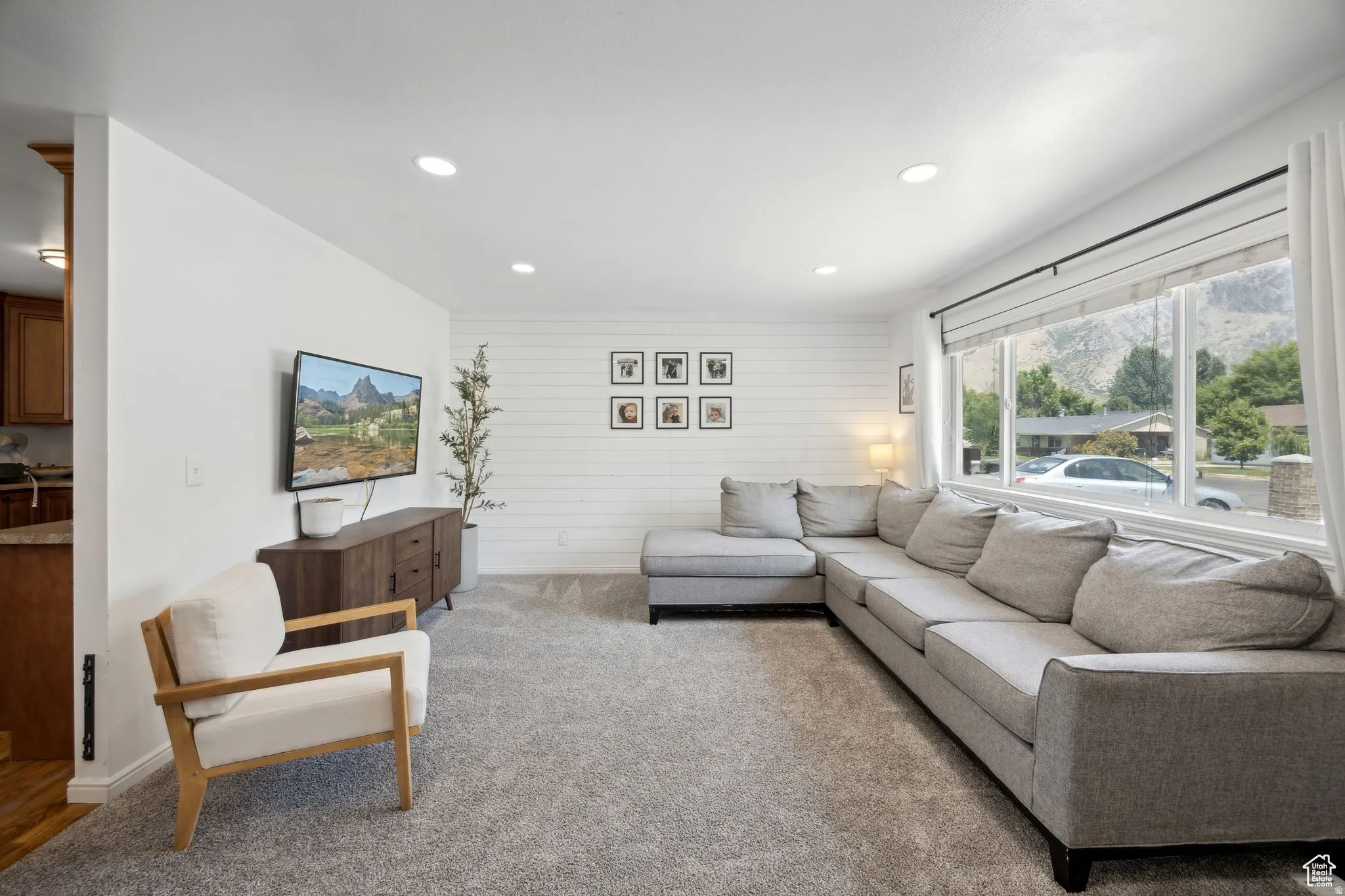 Living room with recessed lighting and carpet