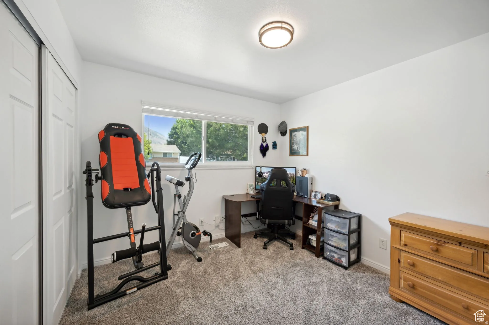 Office area with light carpet and baseboards