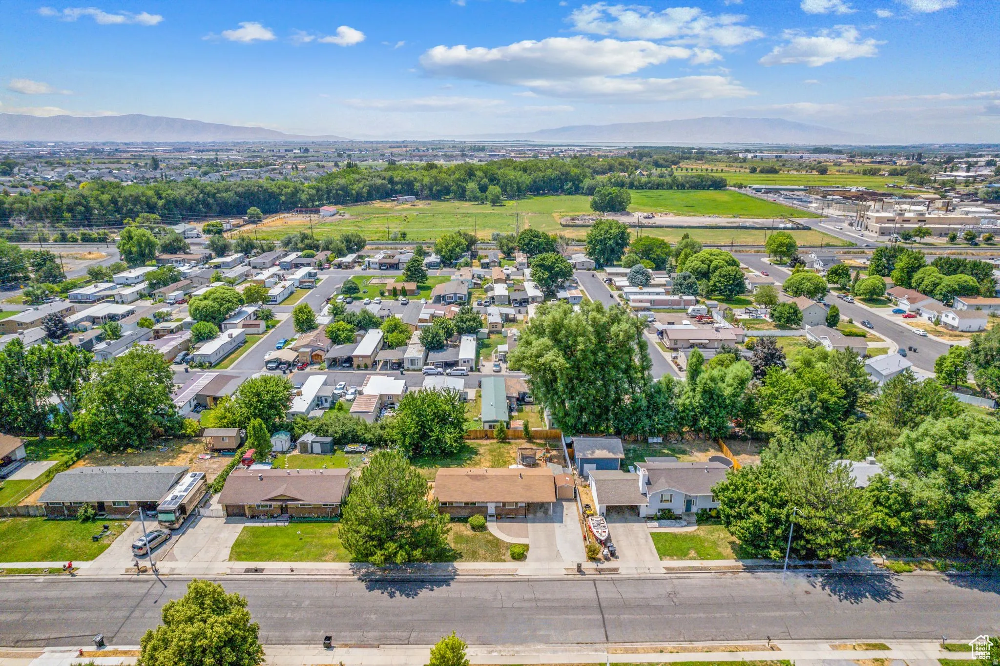 Aerial view of residential area featuring mountains