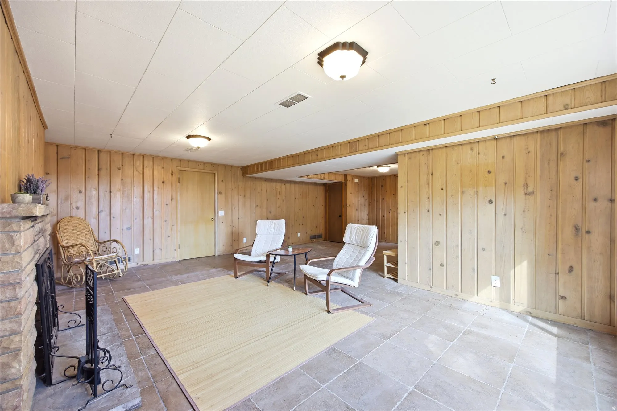 Sitting room with wood walls