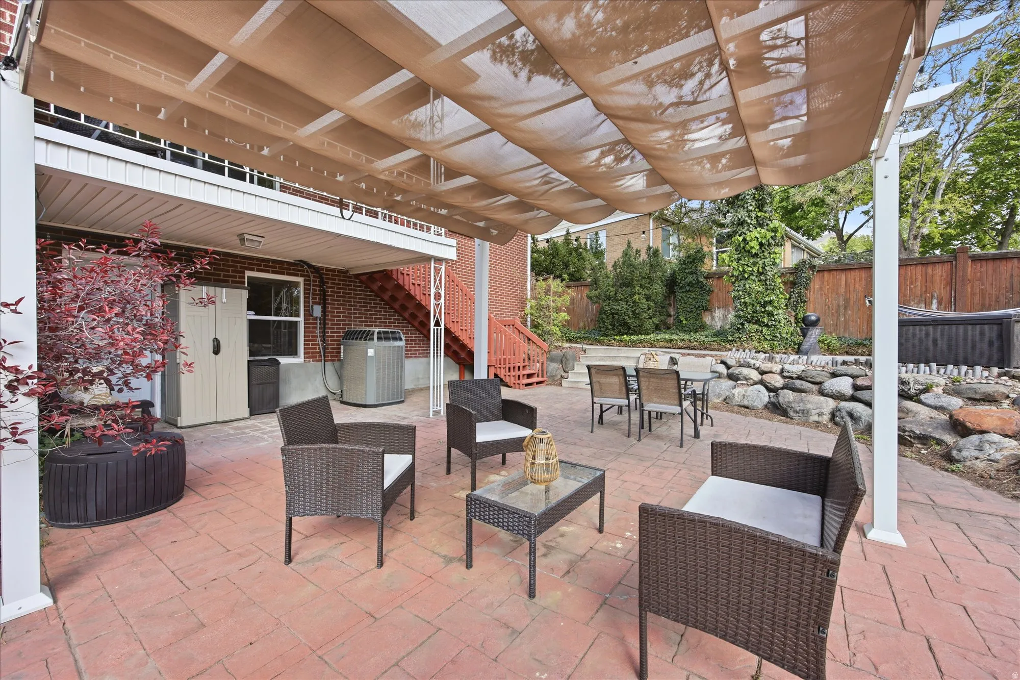 View of patio featuring stairs and outdoor lounge area