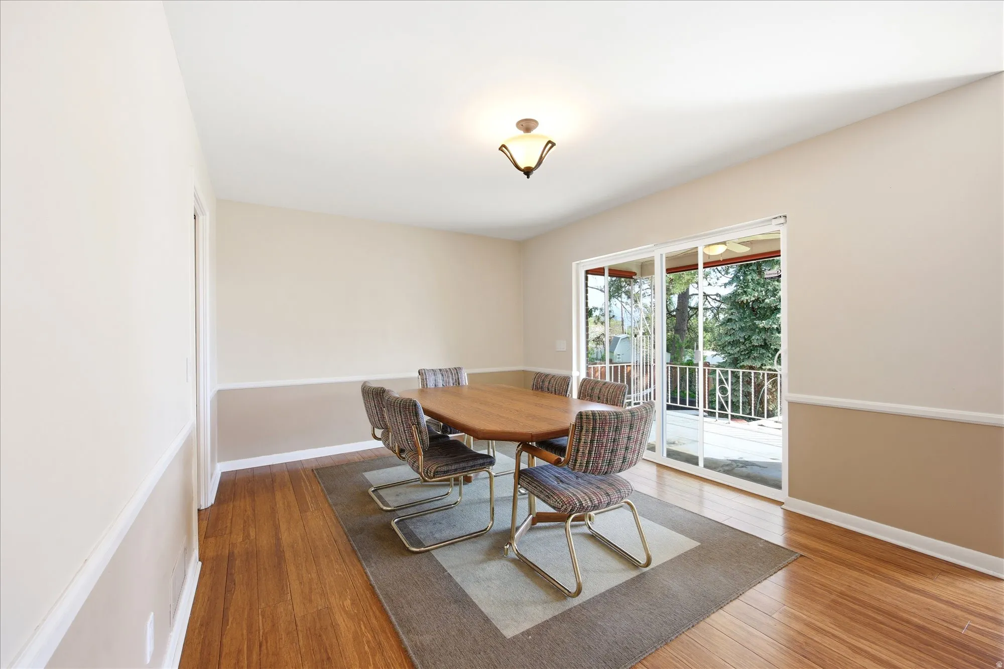 Dining space featuring light wood-style flooring and baseboards