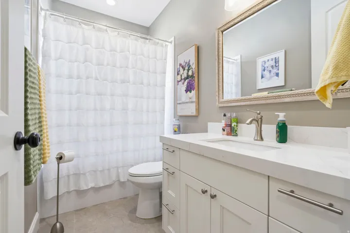 Full bathroom featuring vanity and shower / bath combination with curtain