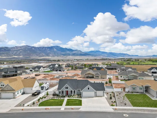 View of mountain backdrop featuring nearby suburban area
