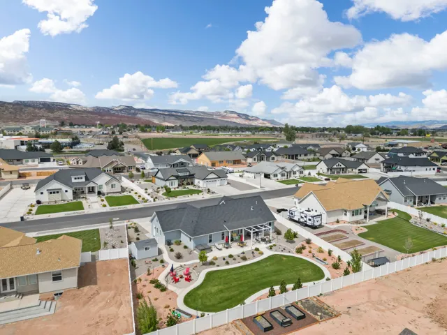 Aerial perspective of suburban area featuring a mountainous background