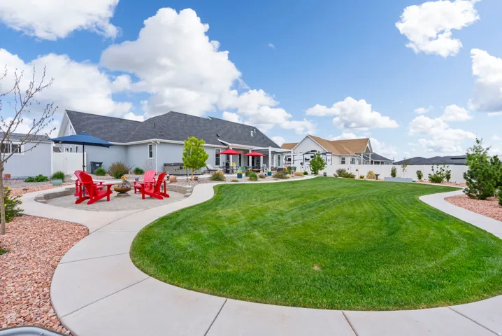 View of property's community featuring a fenced backyard, an outdoor fire pit, and a patio area