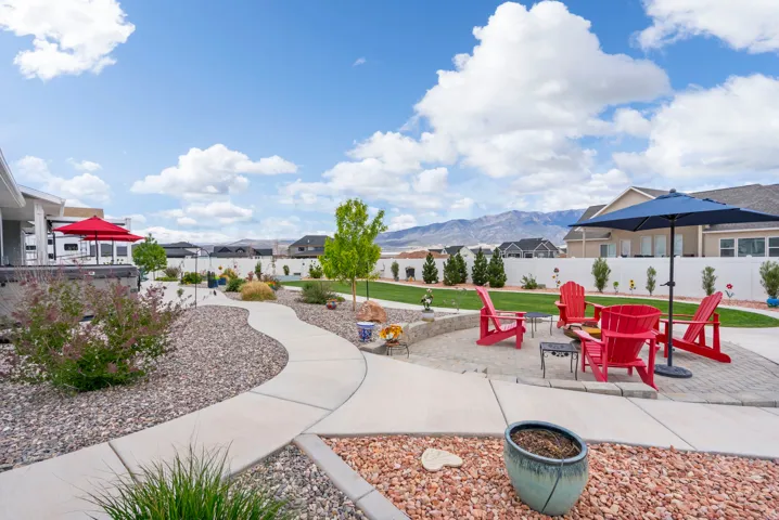View of home's community featuring a mountain view, a residential view, an outdoor fire pit, and a patio area