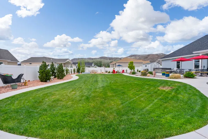 Fenced backyard with a mountain view and a residential view