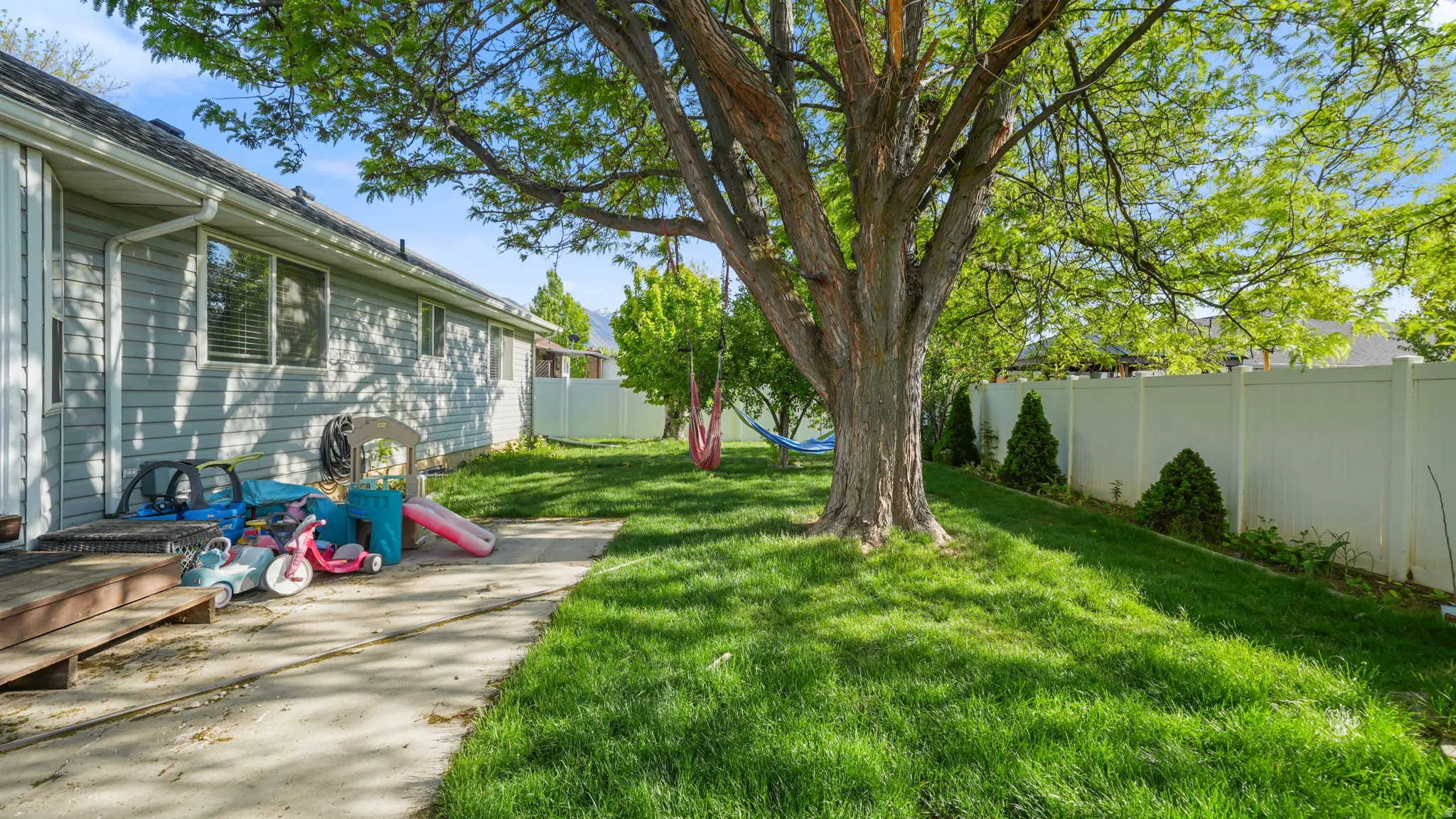 View of fenced backyard