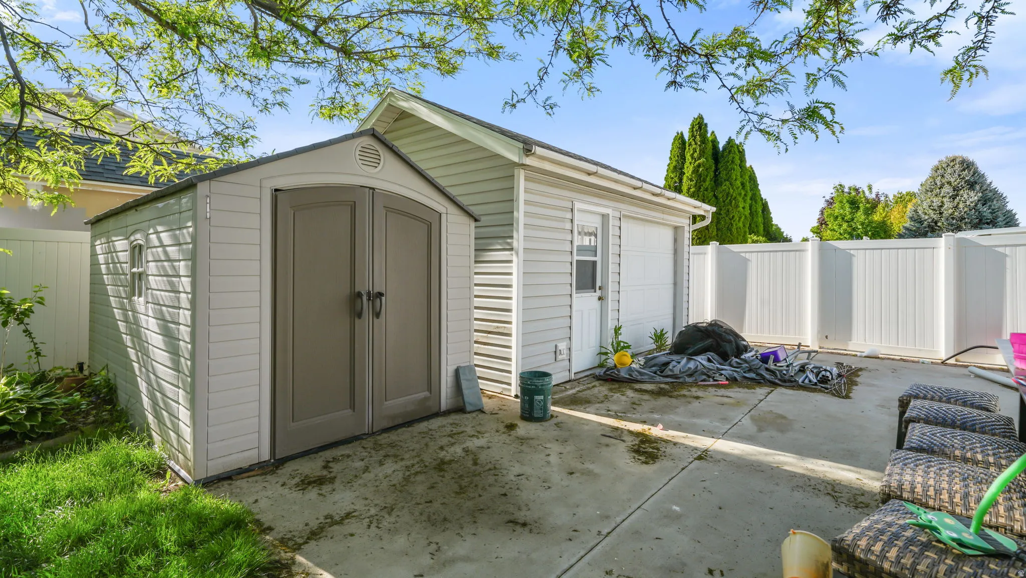 View of shed with a fenced backyard