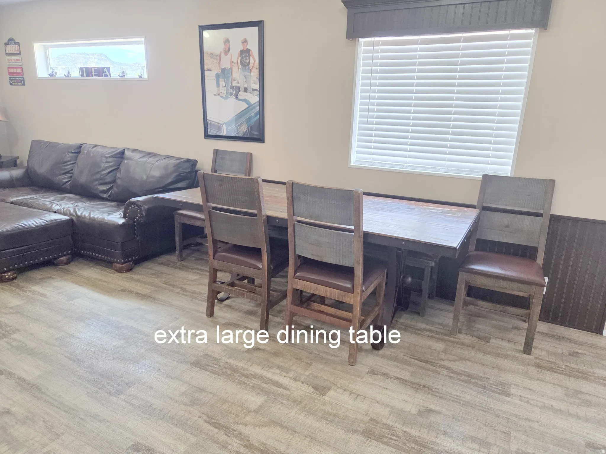 Dining area featuring light wood-style floors and lots of seating.