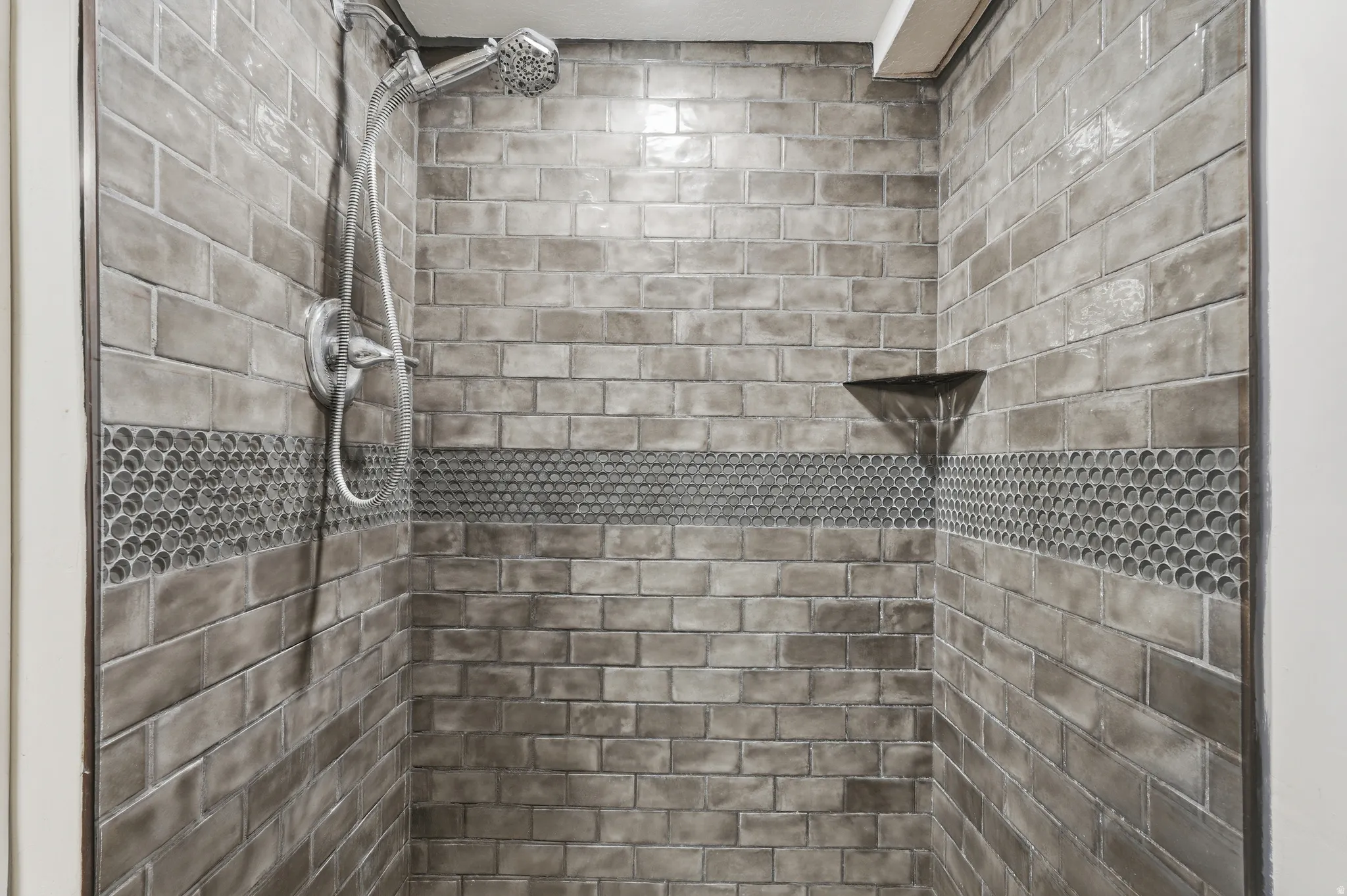 Bathroom view of a tile shower
