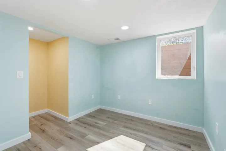 Spare room featuring light wood finished floors and recessed lighting