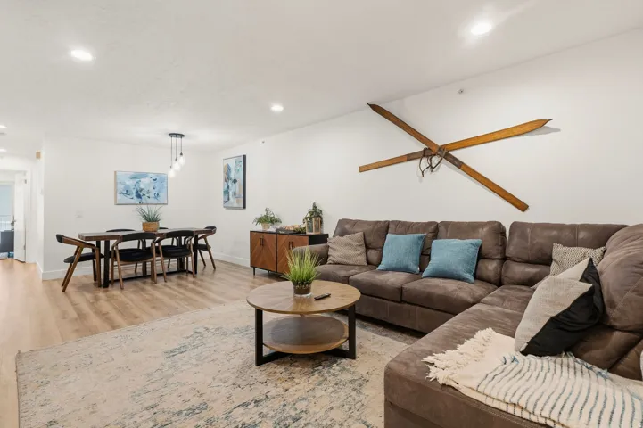 Living room featuring light wood-style flooring and recessed lighting