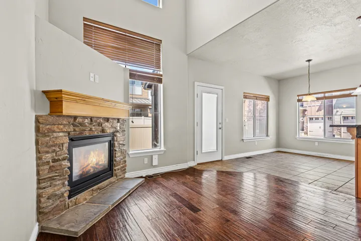 Stone-faced fireplace with a substantial wood mantel