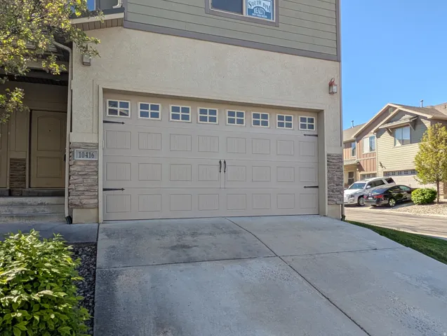 Garage featuring driveway