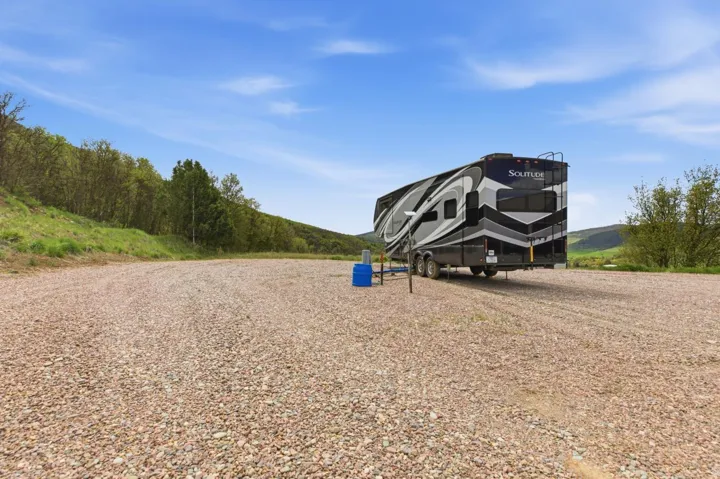 View of front of home- with 2 spots for rv hookups