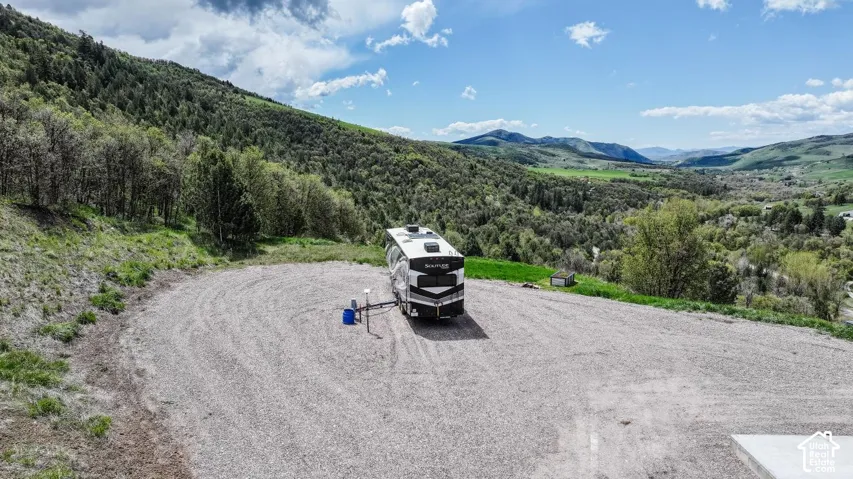 Bird's eye view of mountains and a forest with rv hookups ready