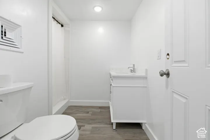 Bathroom with vanity and light wood-style flooring