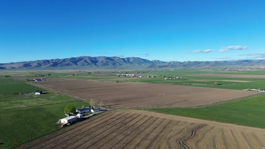 Overview of rural landscape featuring mountains and farmland