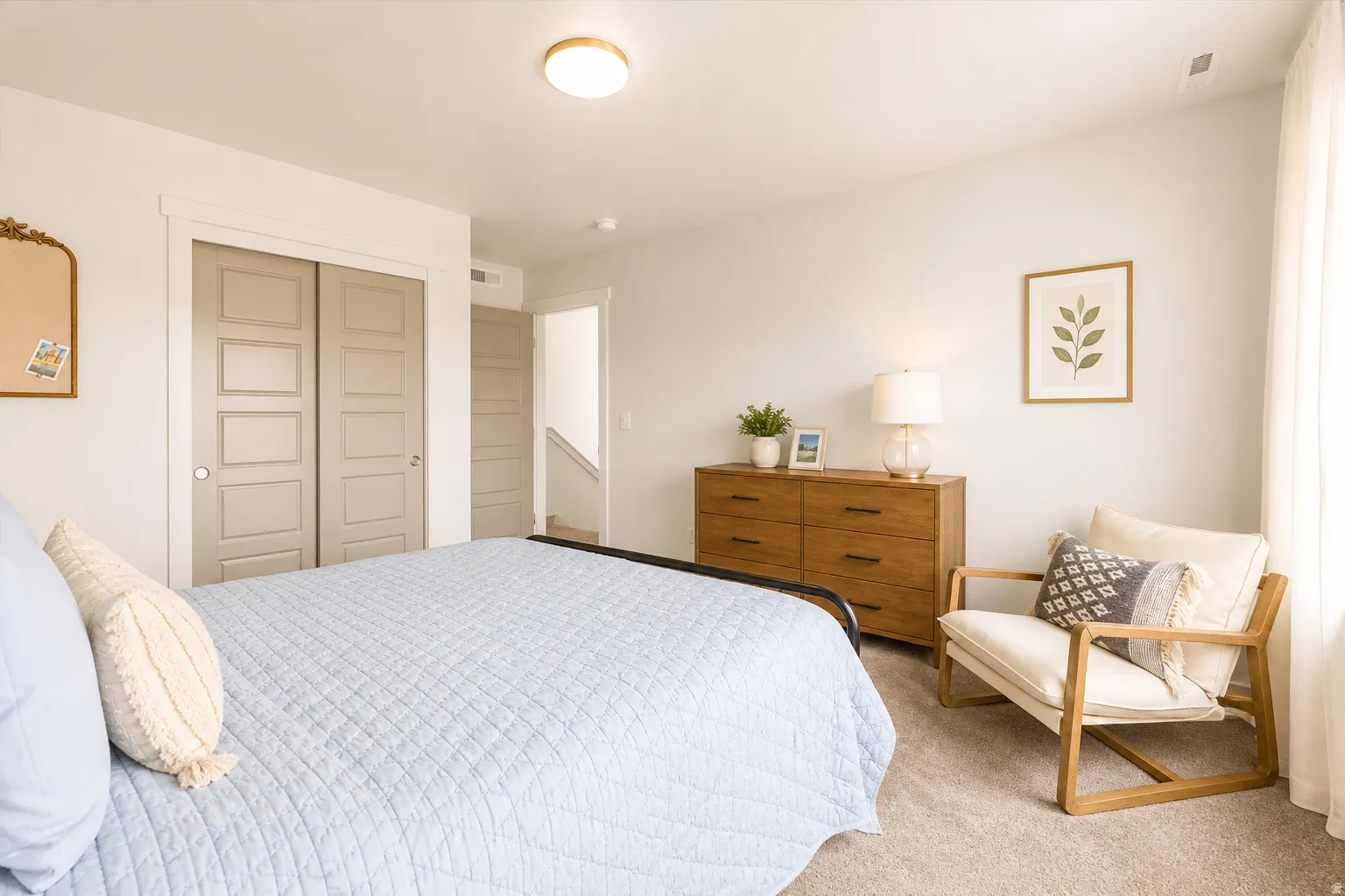 Neutral tone walls with light-colored carpeting