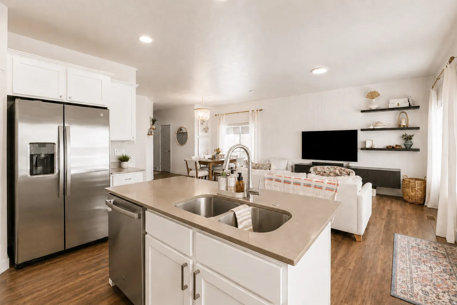 Kitchen island with a dual basin undermount stainless steel sink and a gooseneck faucet