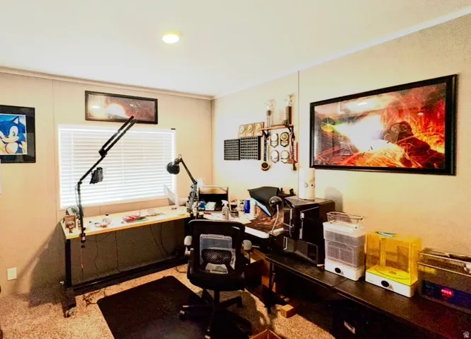 Office with crown molding and recessed lighting