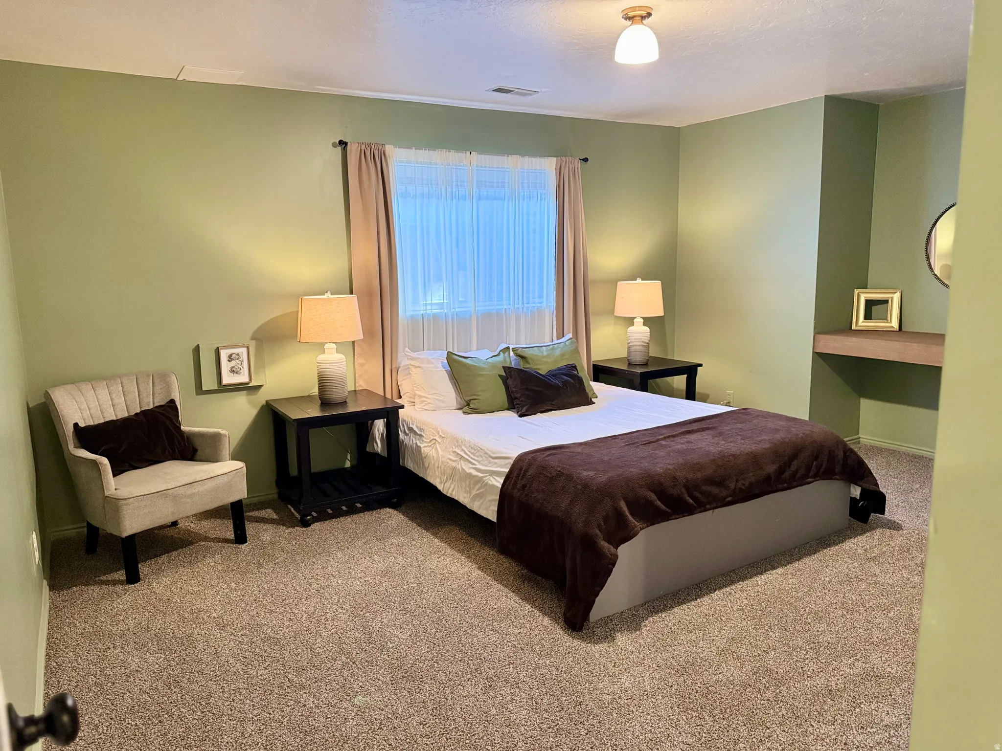 Carpeted bedroom featuring baseboards