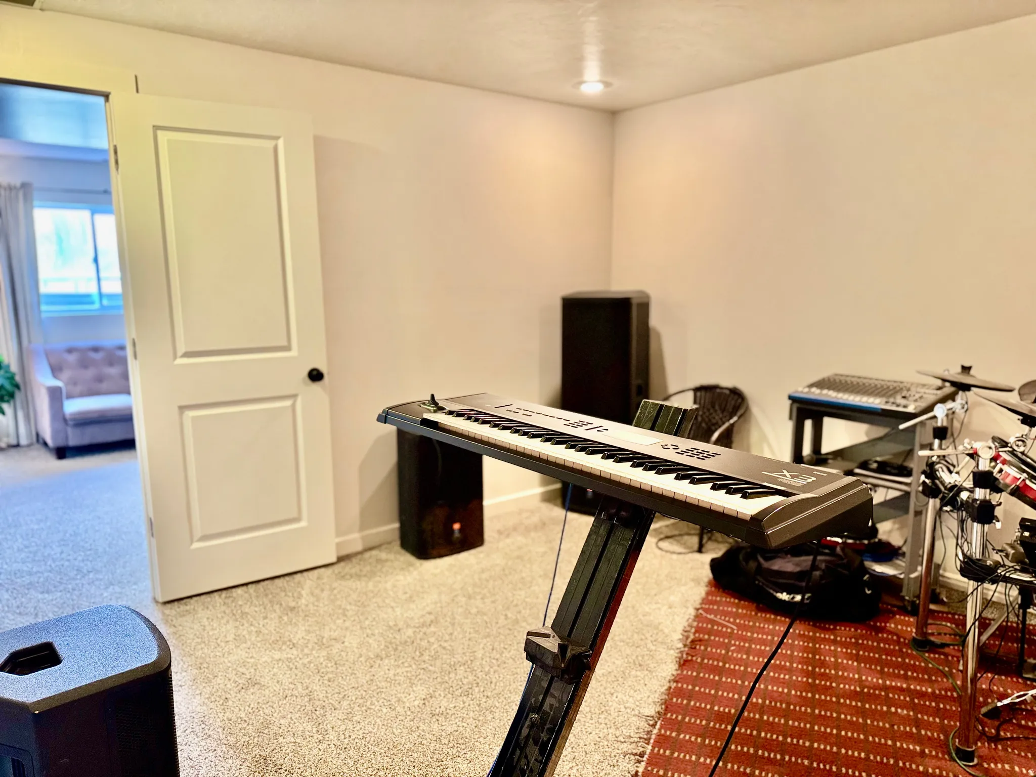 4th bedroom, featuring light colored carpet and baseboards