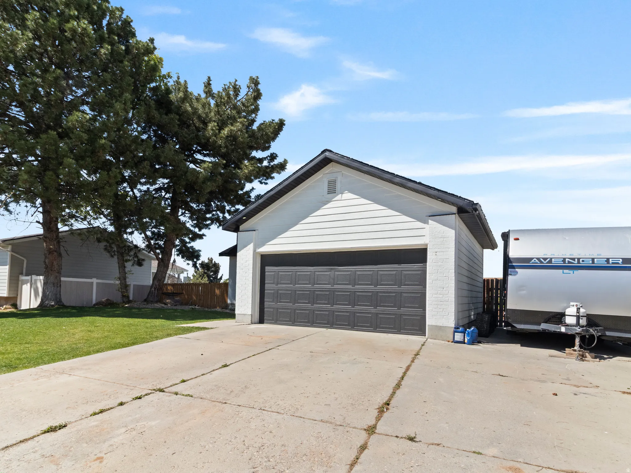 Garage with concrete driveway