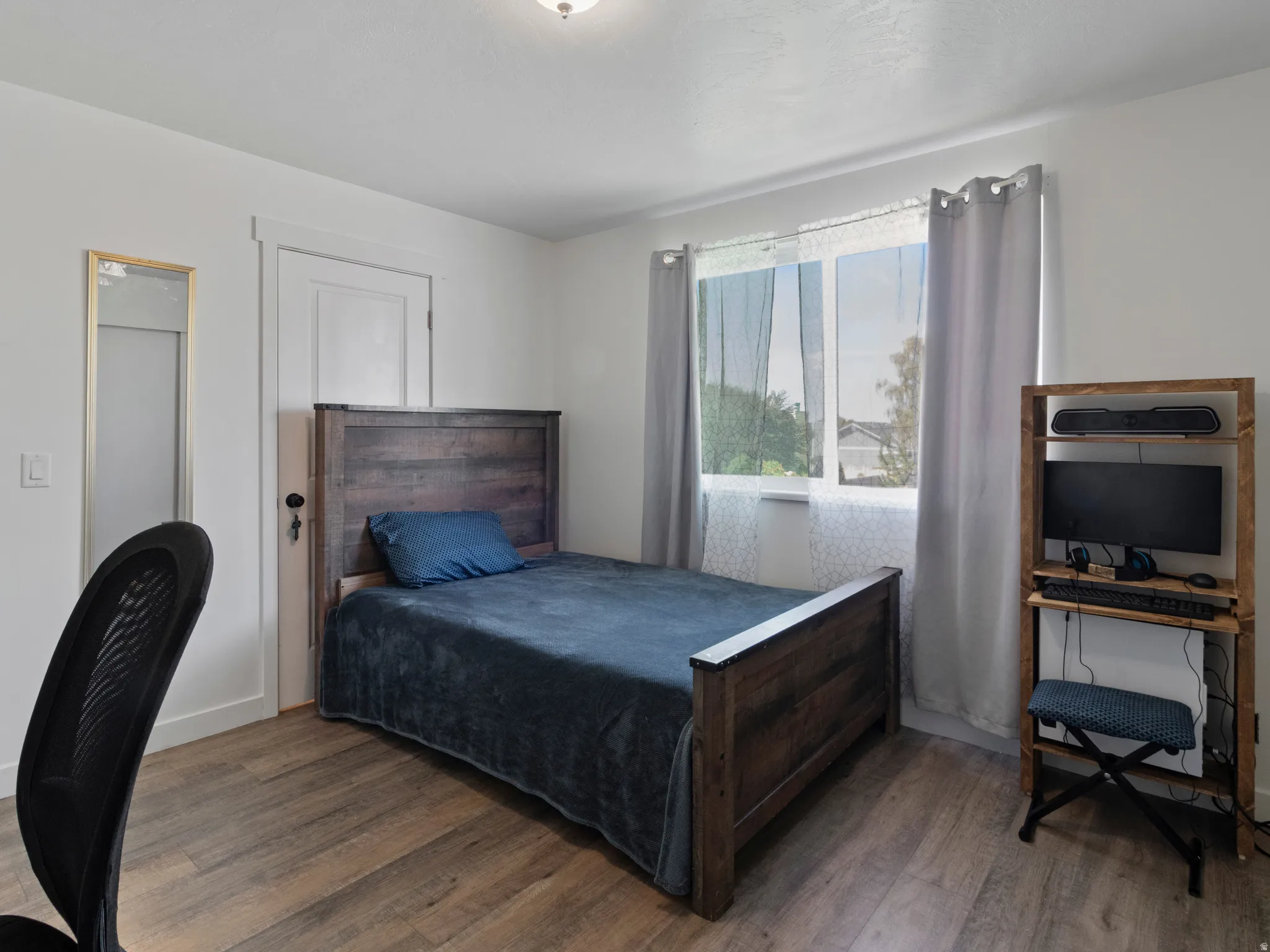 Bedroom featuring wood finished floors