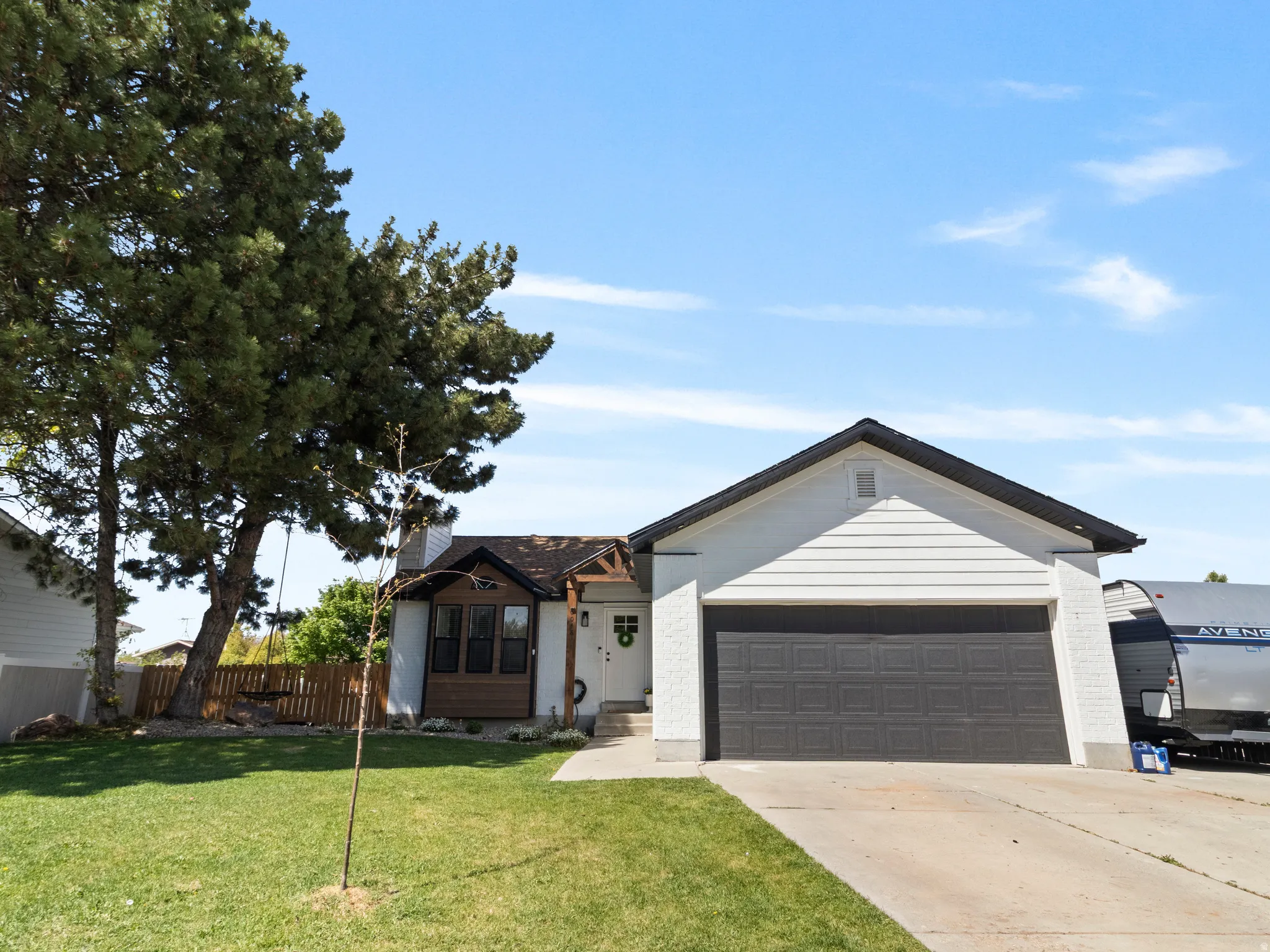 View of front of home featuring a garage and driveway