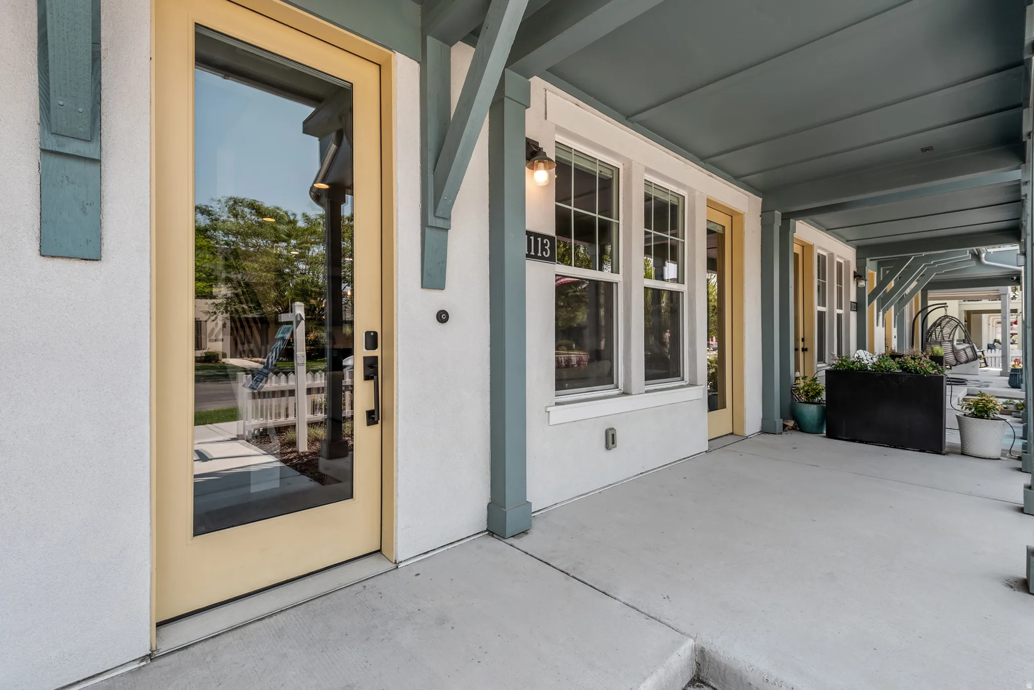 Covered front porch with concrete flooring