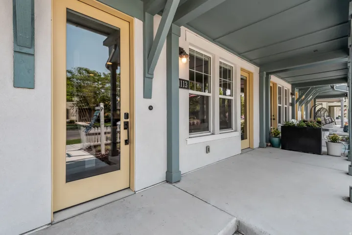 Covered front porch with concrete flooring