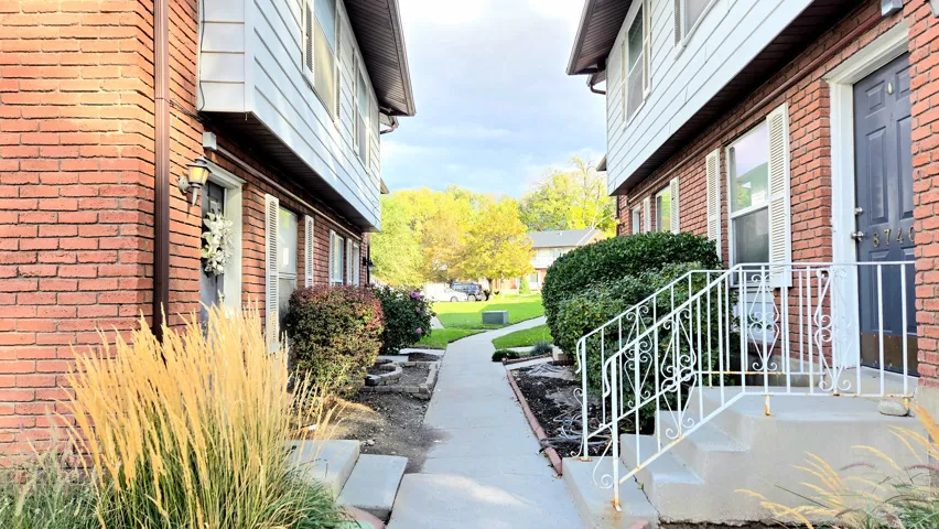 View of side of home featuring brick siding