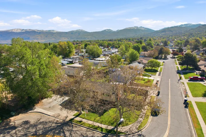 Aerial perspective of suburban area with a mountainous background