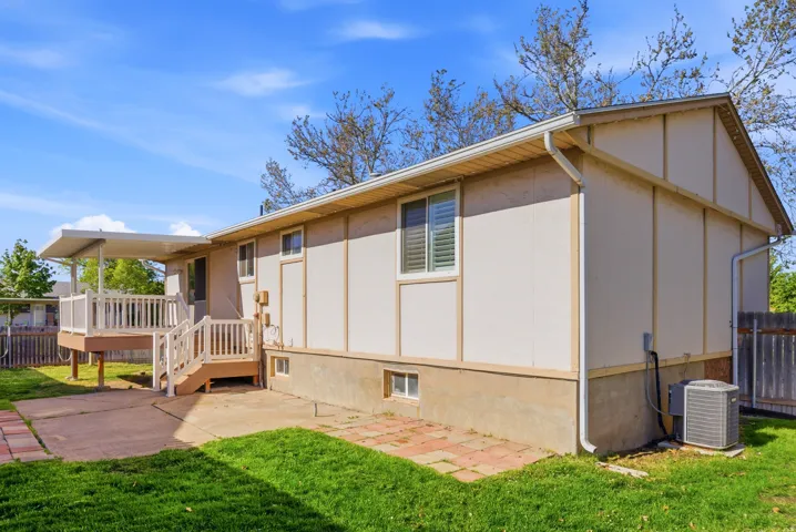 Rear view of house featuring a deck