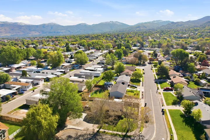 Aerial perspective of suburban area with a mountain backdrop