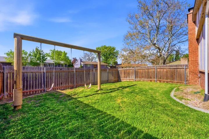 View of fenced backyard