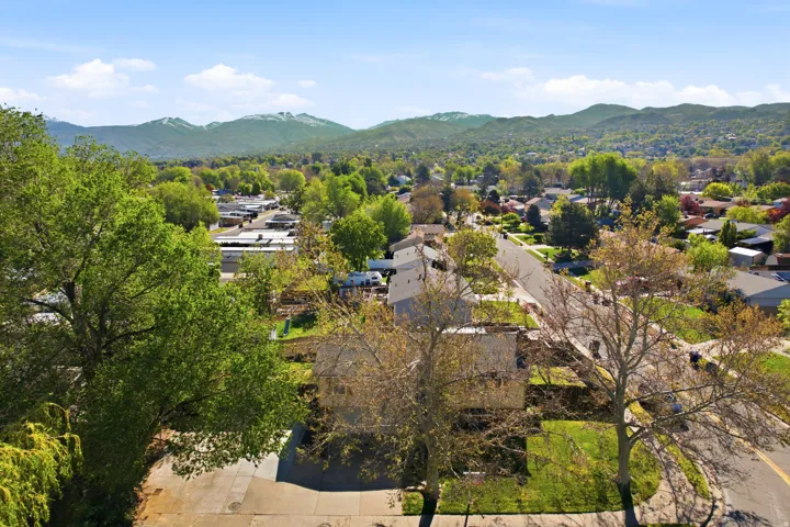 Aerial view of residential area featuring mountains
