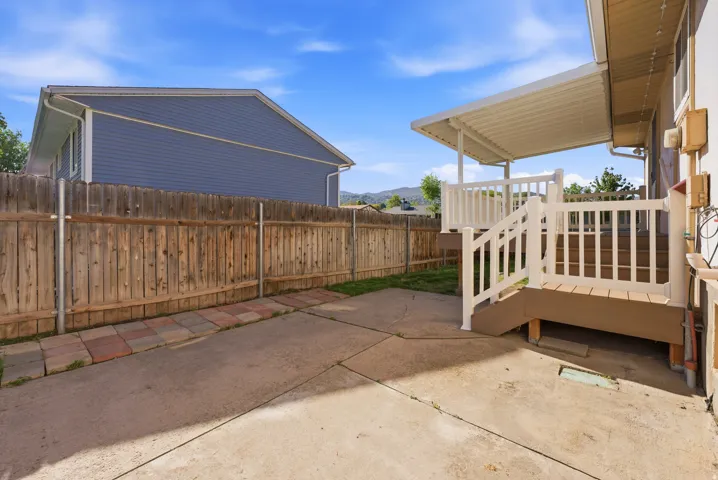 Fenced backyard featuring a patio area