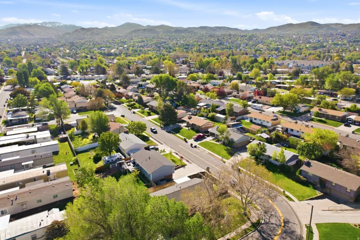 Aerial perspective of suburban area featuring a mountain backdrop