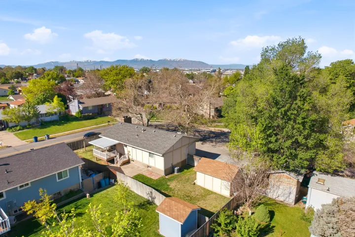 Aerial view of residential area featuring a mountainous background